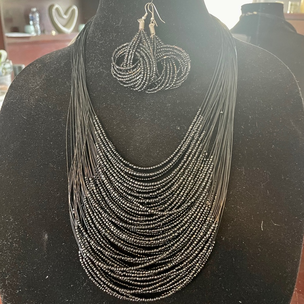 Multi layered black beaded necklace and matching earrings